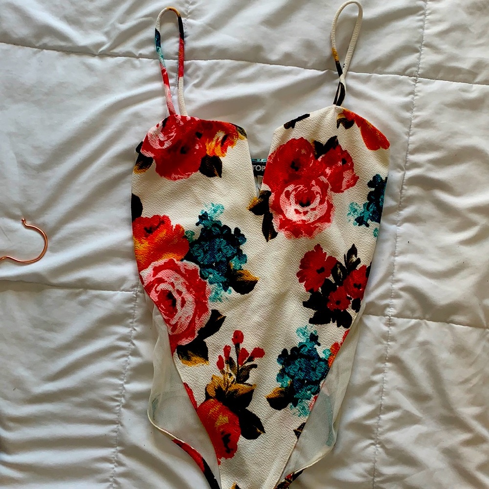 Mystique Boutique- floral low cut body suit